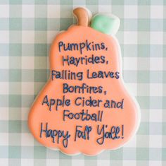 a decorated cookie that says pumpkins, hayrides, falling leaves, bonfires, apple cider and football happy for you