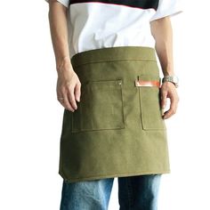 a man is wearing an apron with pockets on the front and side, while standing against a white background