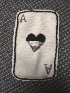 a close up of a person's shirt with a patch on it