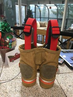 there is a pair of safety equipment in the back pocket of a work boot on top of a table