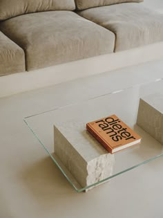 a book sitting on top of a glass table