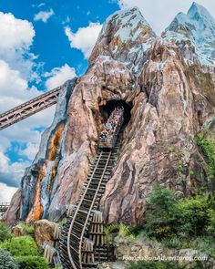 people are climbing up the stairs in front of a mountain at universal studios'avatar