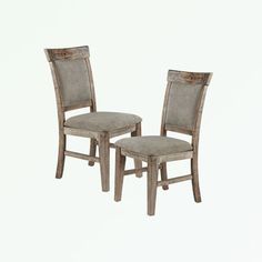 two wooden chairs sitting next to each other on a white background with no one in it