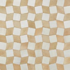 a white and brown tile with squares on it