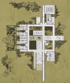 an aerial view of a house with several rooms and bathrooms on the first floor, surrounded by trees