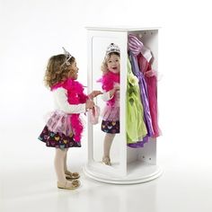 Create the perfect pretend play space for your imaginative little one using the Rotating Dress Up Storage by Guidecraft. This compact unit features a smaller footprint, making it the perfect addition to any size playroom or child's bedroom, while still providing plenty of storage. Shelves and pronged hooks accommodate all your child's favorite costumes, accessories and shoes. Two full-length, inset mirrors are just the right size, allowing children to admire their outfits. Size: 23.5 x 23.5 x 42.  Color: White. Toddler Dress Up Station In Closet, Dress Up Room For Toddlers, Dress Up Stations Walmart, Children's Dress Up Storage, Toddler Costume Closet, Dressing Up Kids Storage, Sign For Dress Up Area, Dress Up Clothes Storage Box, Dress Up Clothes Storage Chest