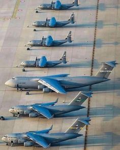 several airplanes are lined up on the tarmac