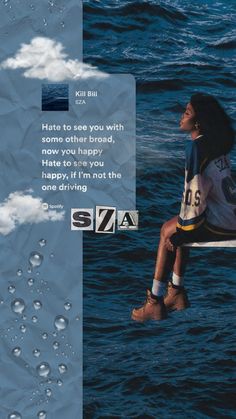 a woman sitting on top of a surfboard in the middle of the ocean with water droplets around her