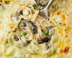 a skillet filled with pasta and mushrooms