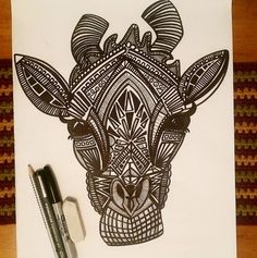 a drawing of a giraffe with intricate designs on it