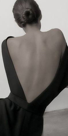 the back of a woman in a black dress