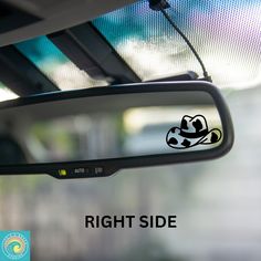 a side view mirror with the words right side on it and a panda bear sticker