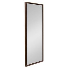 a large mirror mounted to the side of a wooden frame wall hanging on a wall