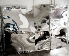 three mirrored mirrors sitting next to each other