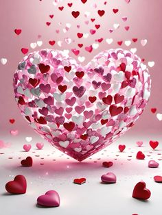 a heart shaped object surrounded by hearts on a pink background with white and red confetti