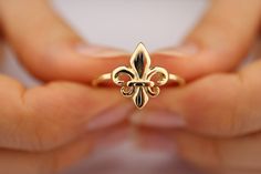 Fleur De Lis French lily flower. 14K Pure Gold European Royal Symbol Ring This solid gold dainty ring is made entirely from 14k solid gold. * Jewelry is packaged and shipped in a delicate jewelry gift box. * If you are purchasing it as a gift, please feel free to add a personal note. Anniversary, Gift For Wife, Christmas Gift Gold Kt: 14K solid gold * Available Gold Color: * Guaranteed Authentic 14k Gold, NOT Plated Or Filled * Stamp: 14K Lily Ring, Royal Rings, Gold Flower Ring, Mom Ring, Solid Gold Band, Gold Rings Fashion, Gold Statement Ring, Jewelry Lookbook, Solid Gold Rings