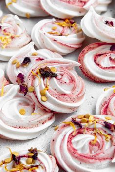 some white and red desserts with yellow flowers on them