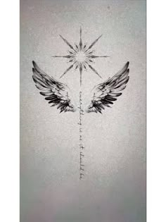 an angel wing tattoo on the back of a woman's shoulder, with stars above it