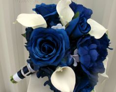 a bridal bouquet with blue and white flowers