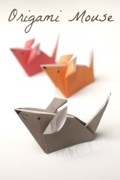 three origami mouses sitting next to each other on a white surface with the words origami mouse above them