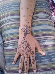 a woman's hand with an intricate design on it