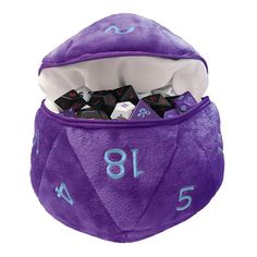 a purple dice bag filled with black and white dice