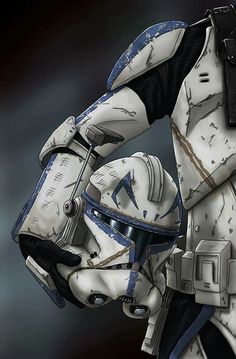 a star wars clone trooper is holding his helmet