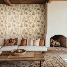 a living room filled with furniture and a fire place next to a wall mounted fireplace