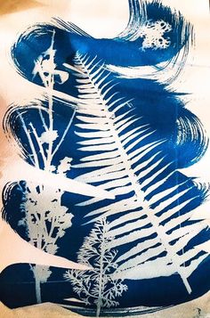 a blue and white painting with trees in the background on a piece of paper that has been printed onto it