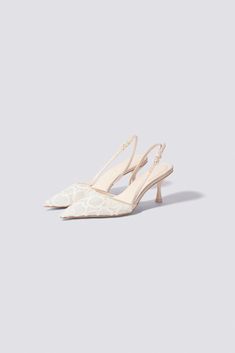 The Dylan Slingback in Point Dume. These heels offer a refined silhouette with delicate lace detailing, poised on a slender heel. Ideal for bringing an air of classic sophistication to any formal attire. Wedding Kitten Heels Bridal, Designer Bridal Shoes, Wedding Dress With Shoes, Wedding Kitten Heels, White Slingback Heels, Graduation Heels, British Man, Formal Heels