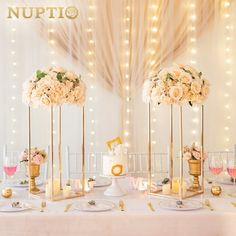 the table is decorated with gold and white flowers