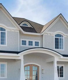 a large white house with an arched doorway