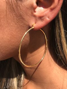 18kt Gold Filled Large Ridged Hoop Earrings Hoop Size: 60mm Width: 2mm Clasp: Hinged Material: 18 Karat Gold Filled, Hypoallergenic. Tarnish Resistant. Gold-filled does not de-laminate or peel like Gold plated Jewelry nor does it tarnish as readily as silver. Generally speaking, gold filled is better quality and will have a much longer lasting color than plated jewelry. We recommend keeping abrasive chemicals away from the jewelry for the items to last. Thank you for visiting and supporting our Gold Hoop Earrings Large, Gold Hoops Large, Large Hoop Earrings Aesthetic, Hops Earrings Gold, Medium Gold Hoop Earrings, Gold Hope Earrings, Golden Hoops Earrings, Gold Hoops Aesthetic, Gold Earrings Big