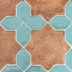 an image of a tile pattern that looks like hexagonals in blue and brown