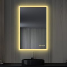 a bathroom sink sitting under a mirror next to a wall mounted faucet with lights on it