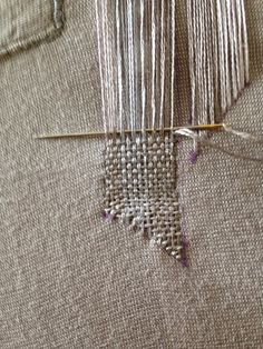 a close up of a piece of cloth with thread