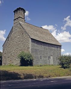 an old stone building with a steeple on the top