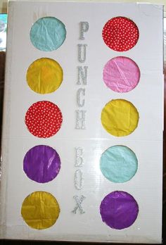 a book with different colored paper circles on the front and back cover that says punch box