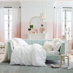 a living room with pink and white walls