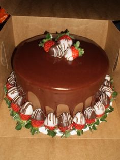 a chocolate cake with strawberries on top