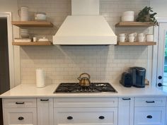 the kitchen is clean and ready to be used as a place for coffee or tea