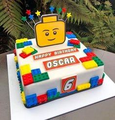 a birthday cake made to look like a lego character