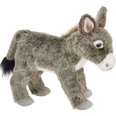 a stuffed donkey is standing on a white background