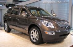 an suv is on display in a showroom