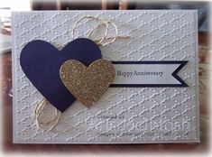 an anniversary card with two hearts on it