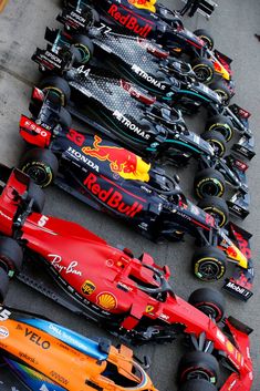 a row of red and yellow race cars lined up