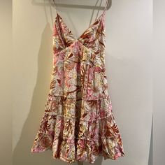 Nwt This Is Perfect For Summer With Its Flowy Floral Print! Size Us Medium 100% Rayon Has A Tie In The Back And A Zipper Closure Never Worn Pink Tiered Sundress, Tiered Floral Dress For The Beach, Tiered Floral Dress For Beach, Tiered Floral Beach Dress, Pink A-line Sundress For Garden Party, Pink Tiered Midi Sundress, Pink Tiered Sundress In Feminine Style, Pink Tiered Sundress Feminine Style, Pink Tiered Feminine Sundress