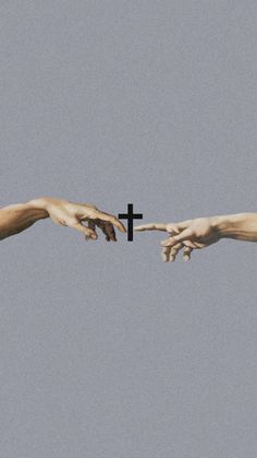 two hands reaching out to touch each other with a cross on the top of them