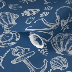 a blue wallpaper with white hand drawn sea creatures on it's side and an ocean themed background