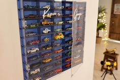 there are many toy cars on display in this room